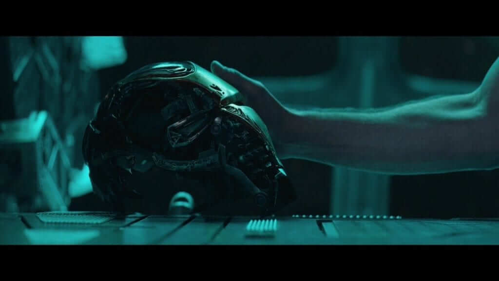 Iron Man's battle damaged helmet being touched in Avengers Endgame