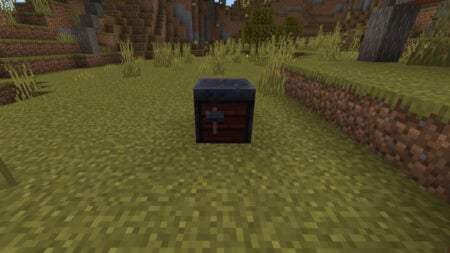 A Smithing Table sits in a field in Miencraft