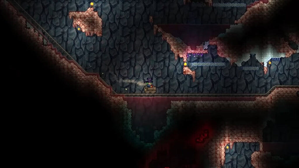 A minecart rolls down the tracks in Terraria