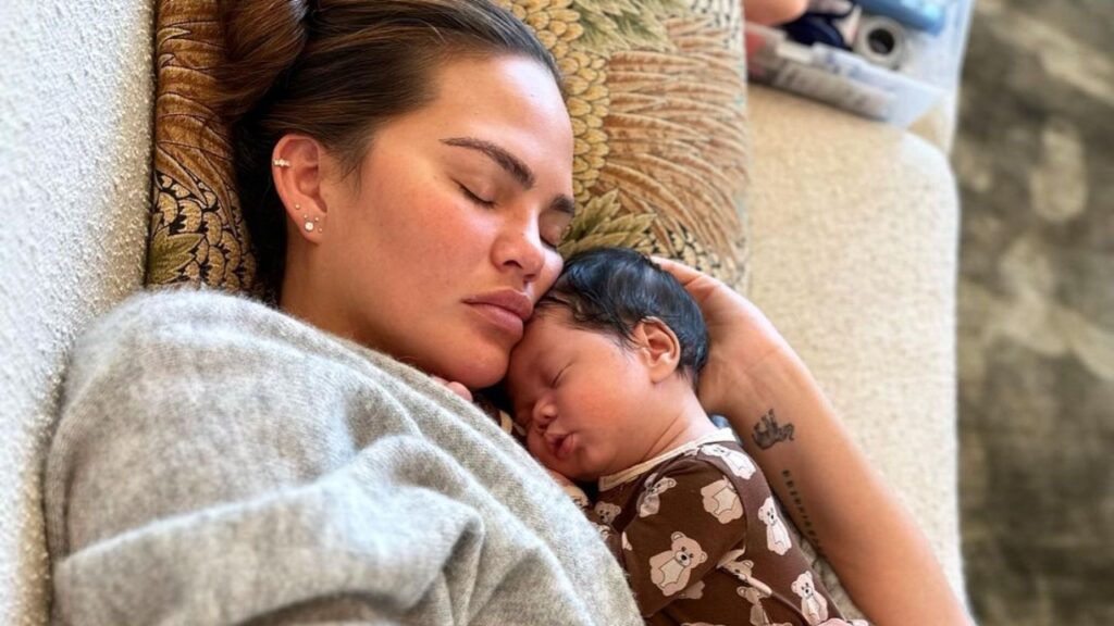 Photo of Chrissy Teigen cradling her new baby