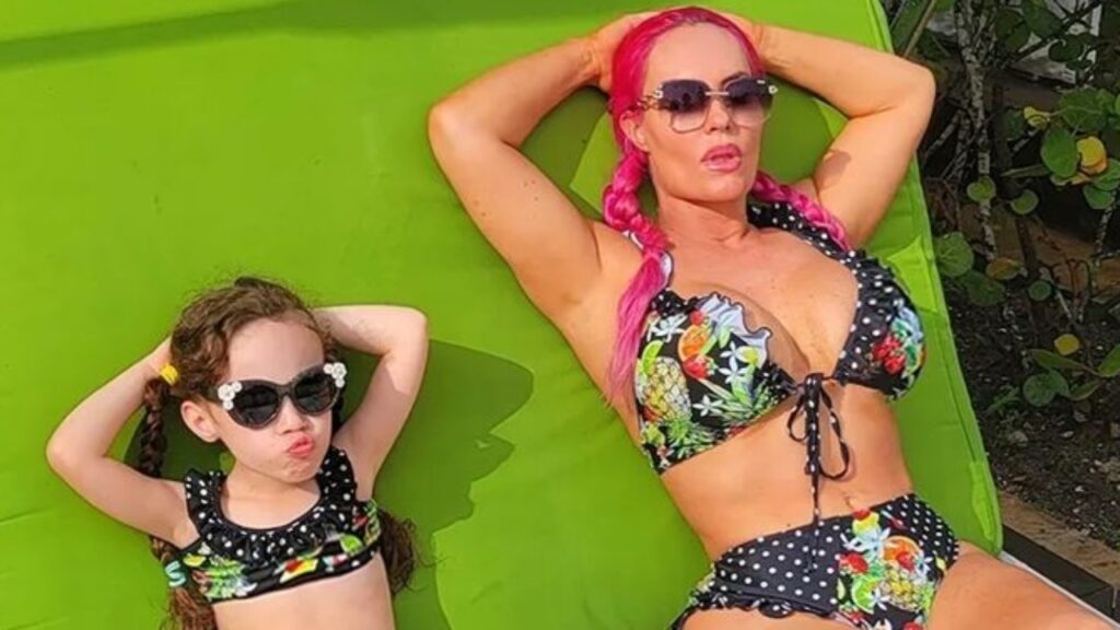 Coco Austin and daughter Chanel Austin lounging in matching swimwear