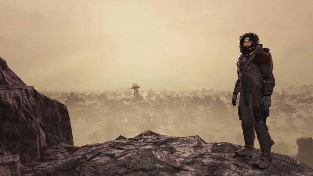 A lone explorer stands on a ridge in Starfield