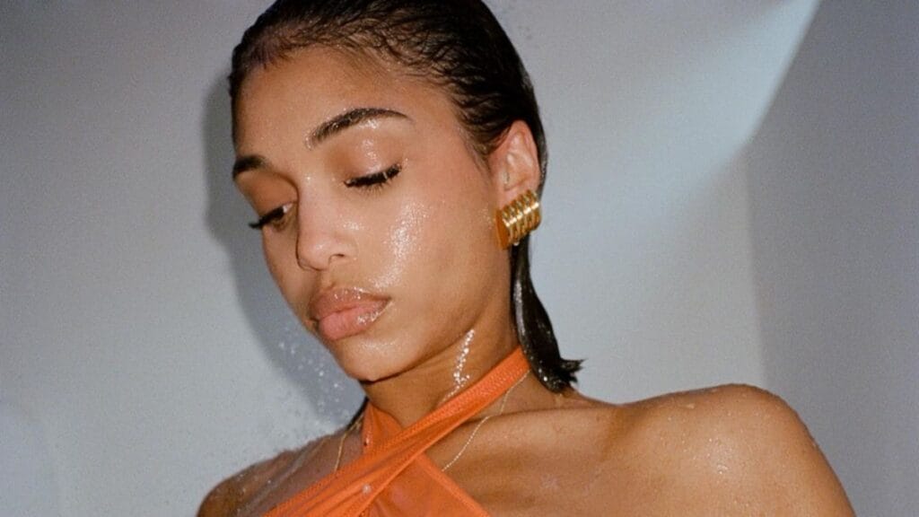 Lori Harvey in orange swimwear from Yevrah