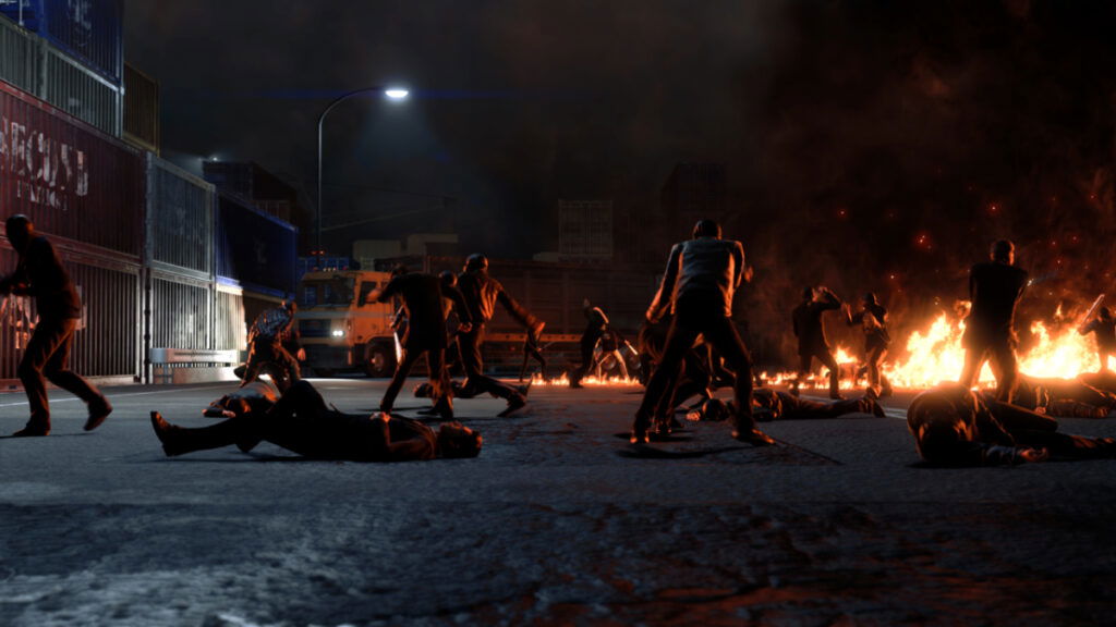 Gangsters brawl on a burning street in the newest Yakuza game