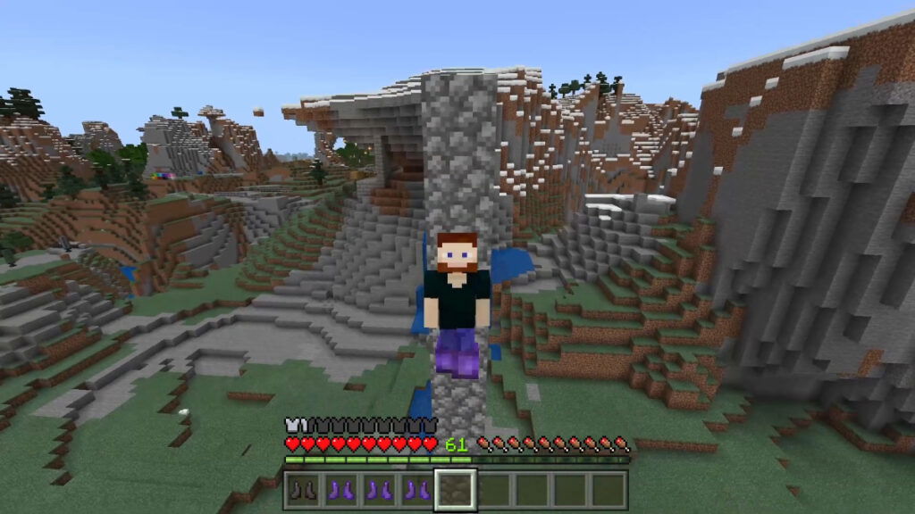 A player falls off a high place in Mojang's sandbox game