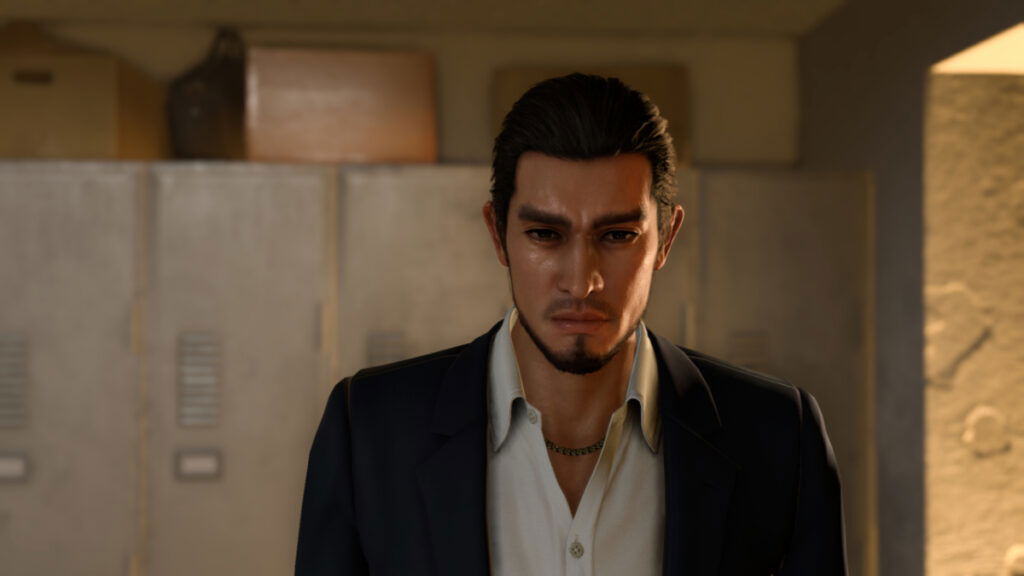 Kasuga is dressed like a salaryman with his hair slicked by in Like a Dragon: Infinite Wealth