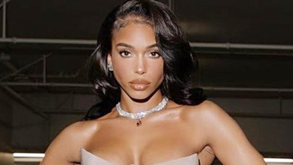 Lori Harvey in a beige tube dress