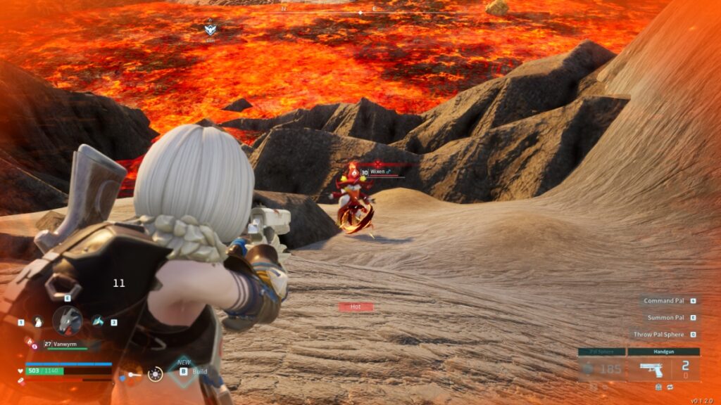 The player aims their handgun at a Pal near some lava in Palworld