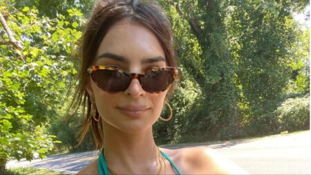 Emily Ratajkowski takes a selfie in green bikini