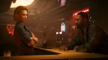 Two characters have a conversation in a bar in Cyberpunk 2077: Phantom Liberty