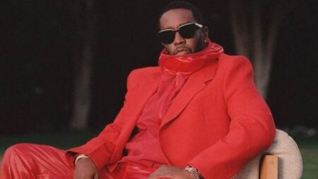 Sean Diddy Combs in red outfit.