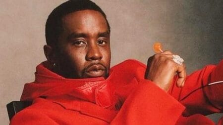 Photo of Sean Diddy Combs in red outfit amid sexual assault scandal