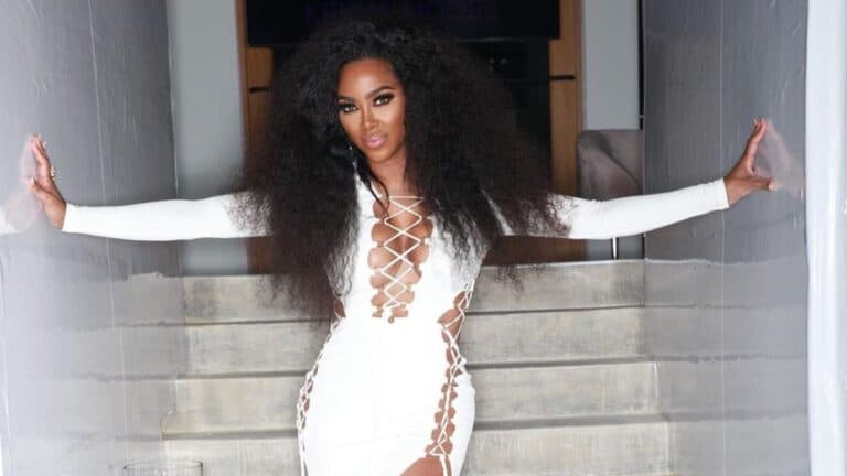 kenya Moore in a white dress