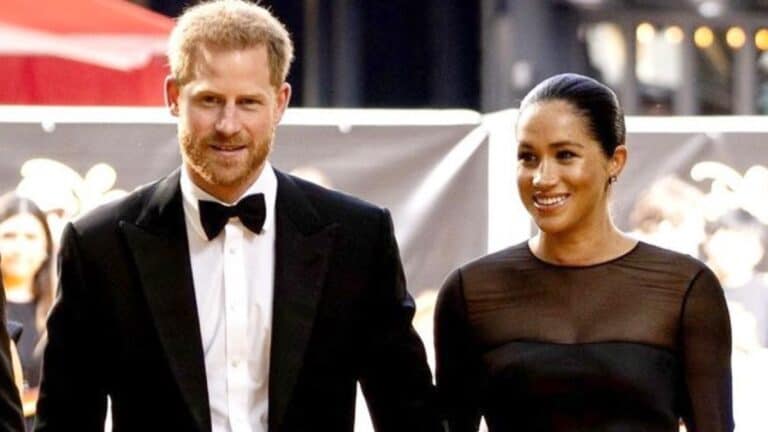 Prince Harry and Meghan Markle attend an event in coordinating black outfits.