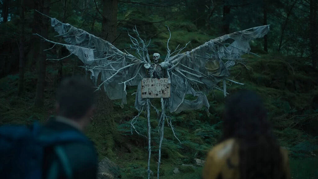 The forest boundary sign in The Watchers