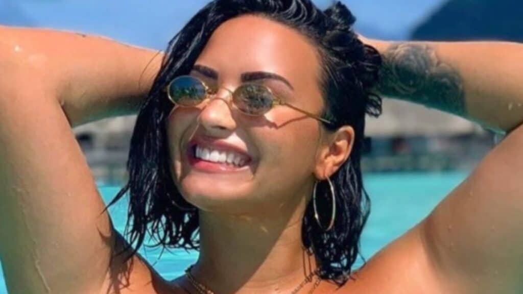 Demi Lovato smiles from a pool