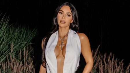 SKIMS founder Kim Kardashian in plunging white dress