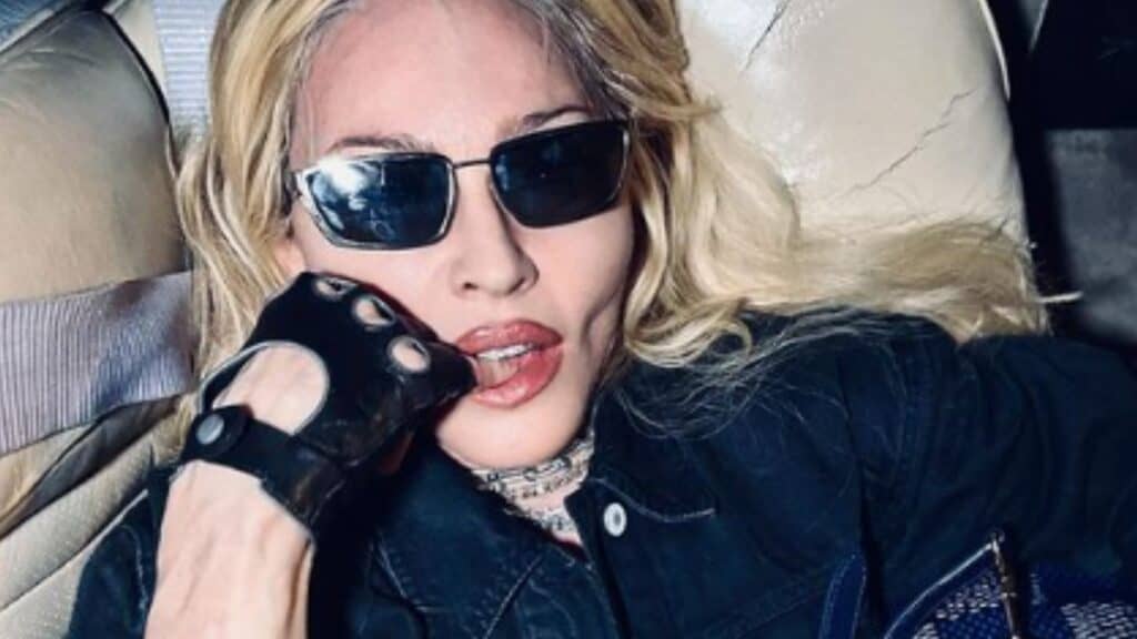 Madonna makes seductive pose in new photos