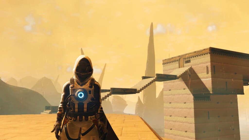 A character and their base are highlighted against a heavy contrast yellow-orange sky in No Man's Sky