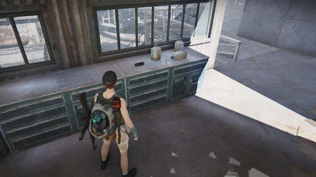 The player collects scrap from atop a cabinet to make Special Parts in Once Human