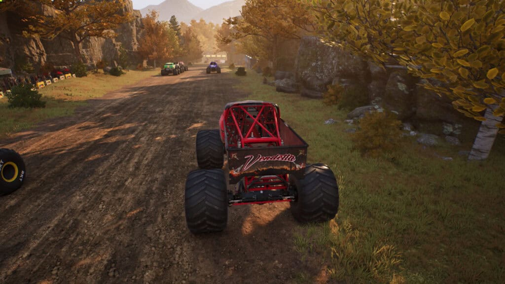 Trucks start a race down a forest track