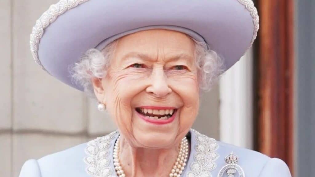 Queen Elizabeth in a lilac hat.