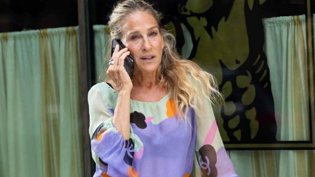 Sex and the City star Sarah Jessica Parker speaks on the phone while filming a scene for Season 3 of And Just Like That...