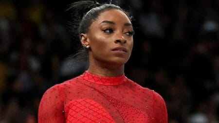 Simone Biles in a red leotard at the Paris Olympics