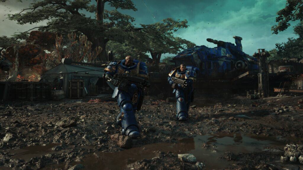 Two Space Marines stride across the battlefield