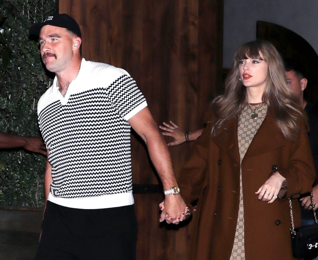 Taylor Swift and Travis Kelce hold hands on date night.