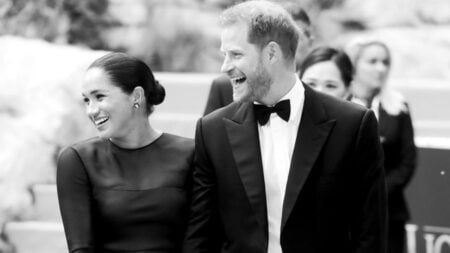 Harry and Meghan in coordinating black outfits