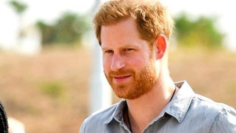 Prince Harry in a blue shirt.