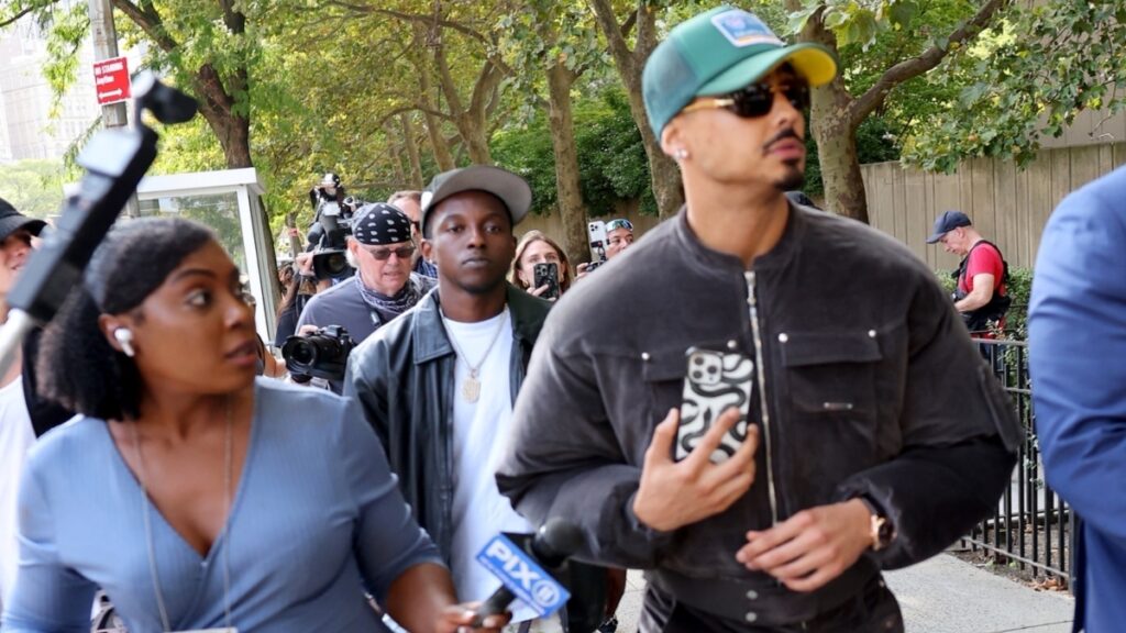 Diddy's adopted son Quincy Brown leaving federal court with paps on his tail.