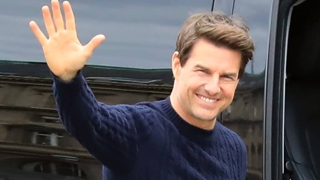 Tom Cruise waving and smiling