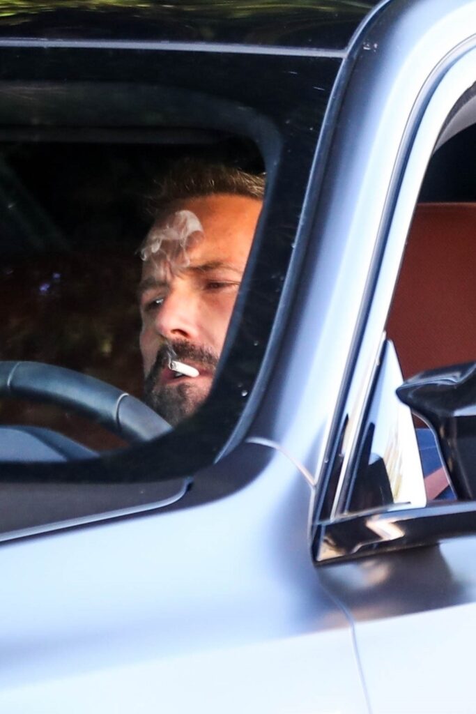 Ben Affleck smokes in his car