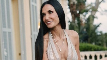 Demi Moore in a lowcut V-neck gown,