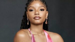 Halle Bailey shows new hairstyle in pink dress.