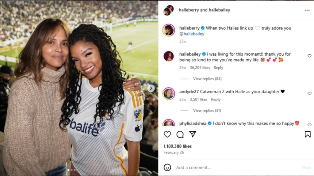 Halle Berry and Halle Berry pose together at a Football game.