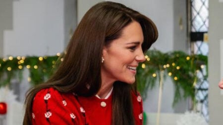 Kate Middleton, the Princess of Wales in a red outfit.