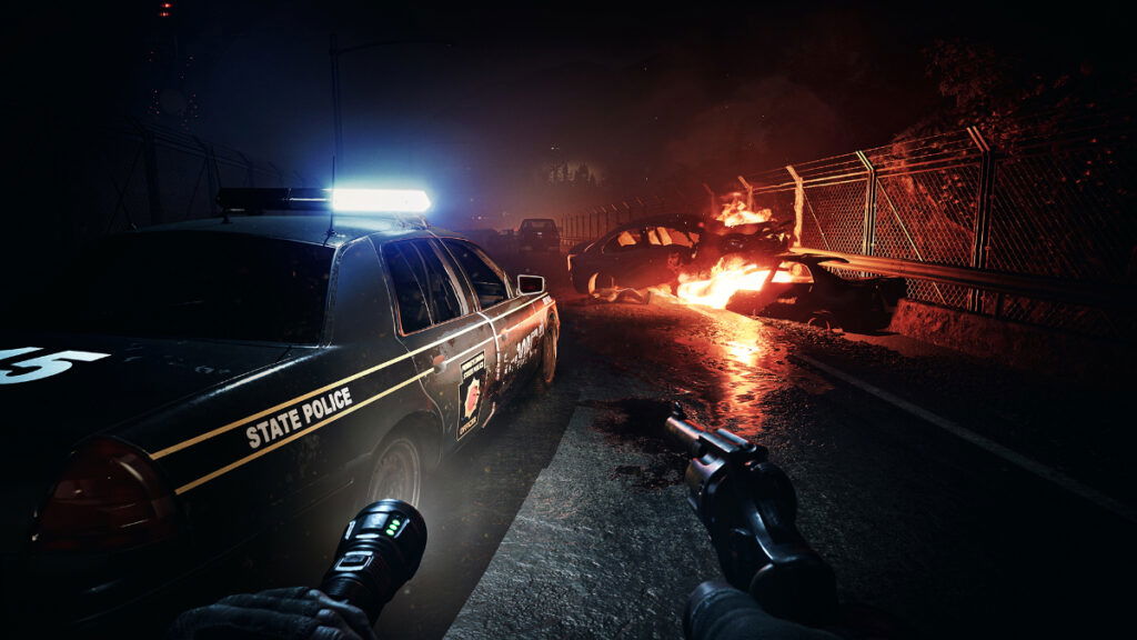 A fire burns behind a cop car in No More Room in Hell 2