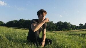 Shawn Mendes outdoors in a field