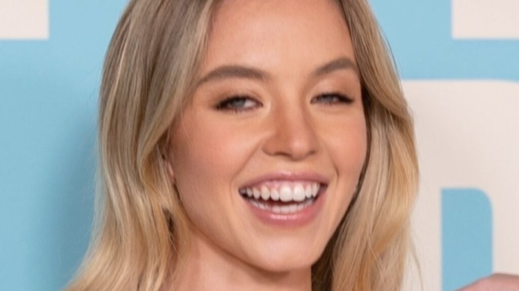 Sydney Sweeney smiles close up