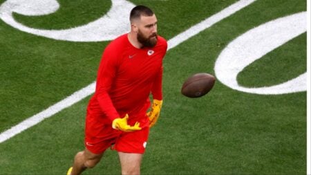 Travis Kelce warming up before a game