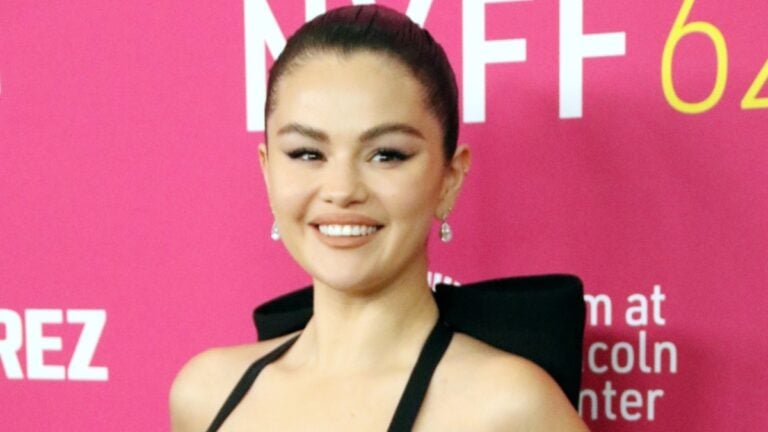 Selena Gomez smiles at an event.