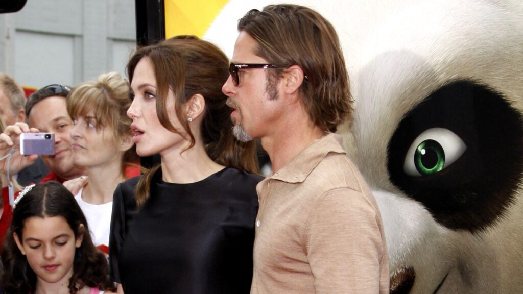 Angelina Jolie, Brad Pitt and their daughter before divorce.