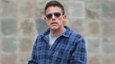 Photo of Ben Affleck in a blue checkered shirt.