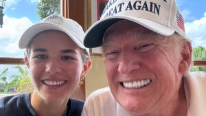 Donald Trump smiling while hanging out with his granddaughter Kai