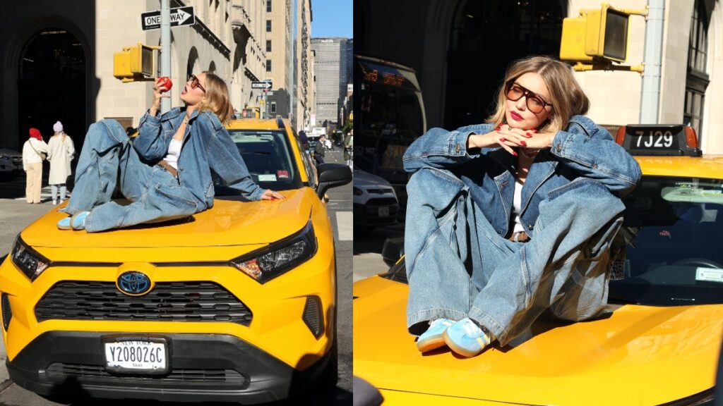 Gigi Hadid perched on a cab during Maybelline commercial filming in NYC.