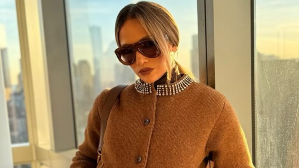 Jennifer Lopez in a brown sweater.