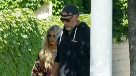 Jessica Simpson wears a silk dress with a thigh-high slit to her daughter Birdie's graduation, accompanied by her family and husband Eric Johnson.